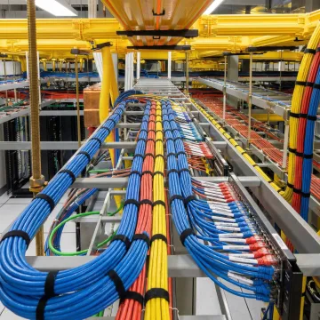 Organized network cabling installation with labeled patch panels and cable management