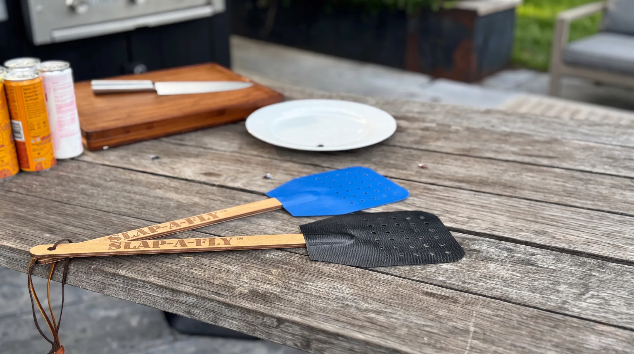 Slap-a-Fly military-grade flyswatter with perforated head and wooden handle