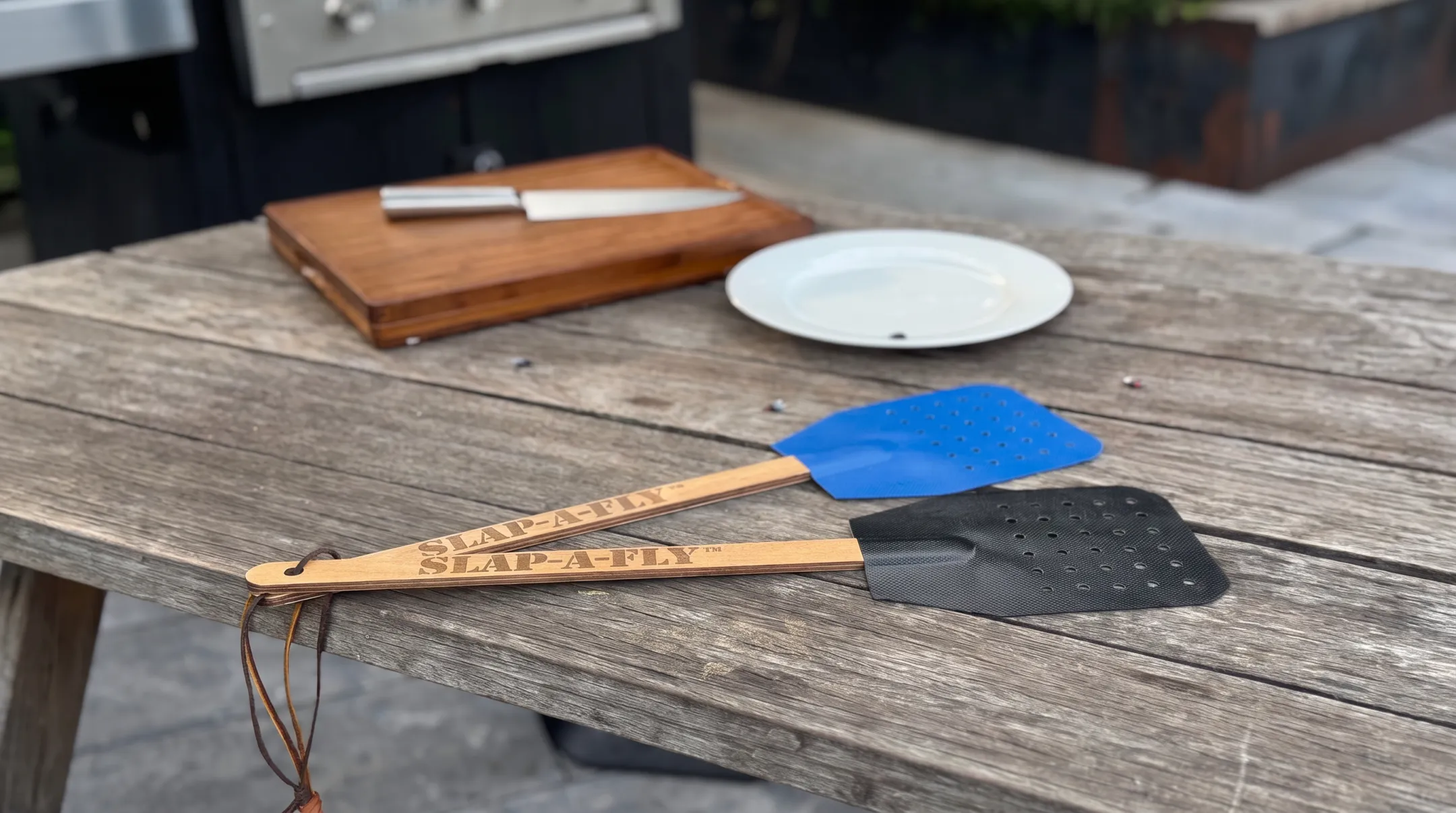 Slap-a-Fly swatter head showing Herculite 80 perforated fabric and spruce handle