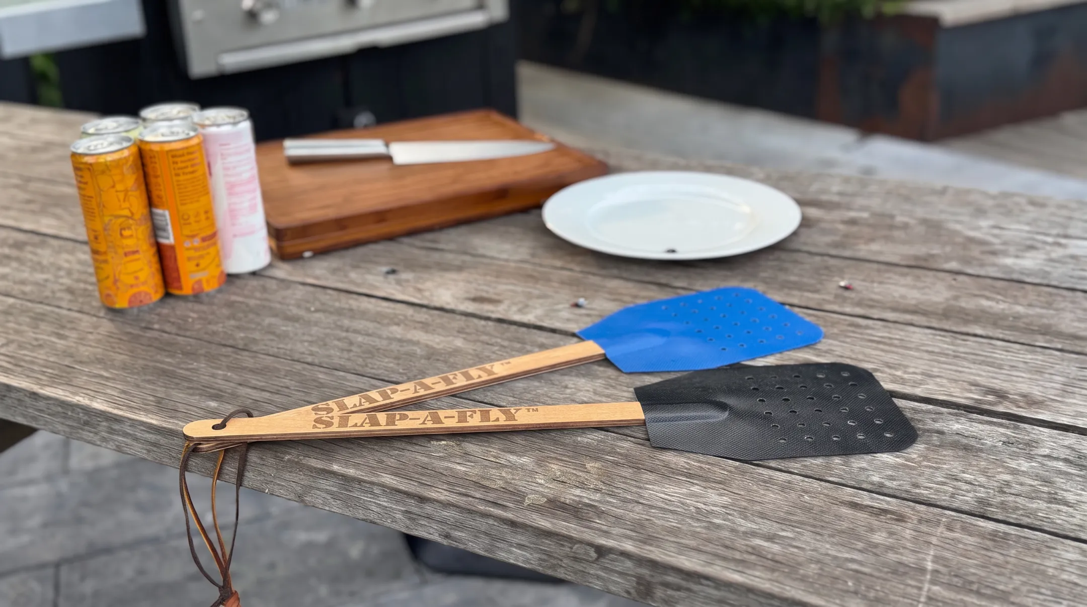 Slap-a-Fly military-grade swatter showing MIL-SPEC fabric and handle