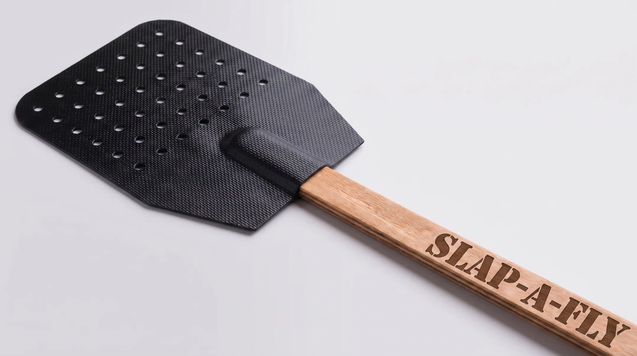 Slap-a-Fly Standard flyswatter showing mesh strike surface and handle design