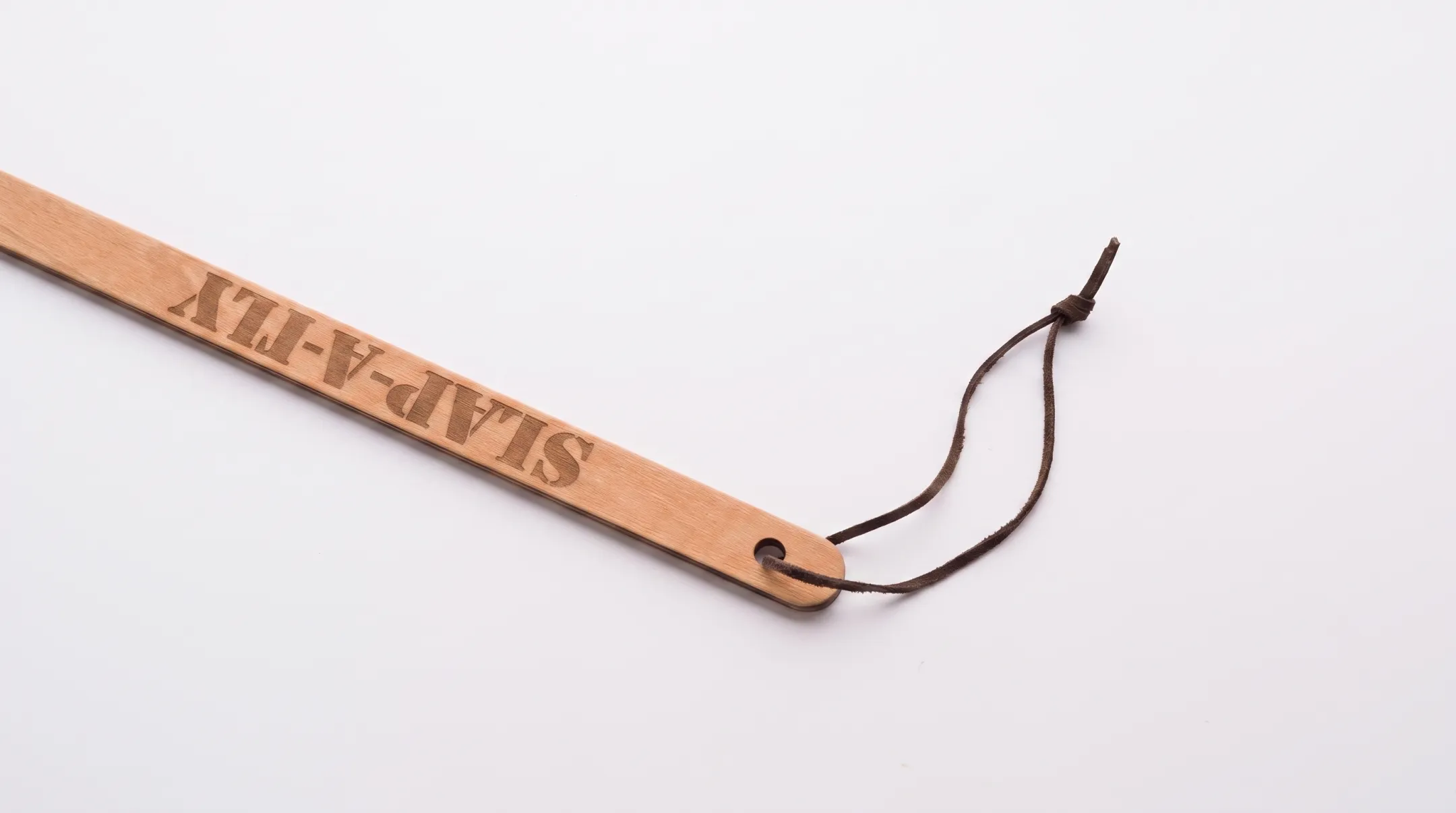 Slap-a-Fly flyswatter with Herculite strike surface on wooden handle
