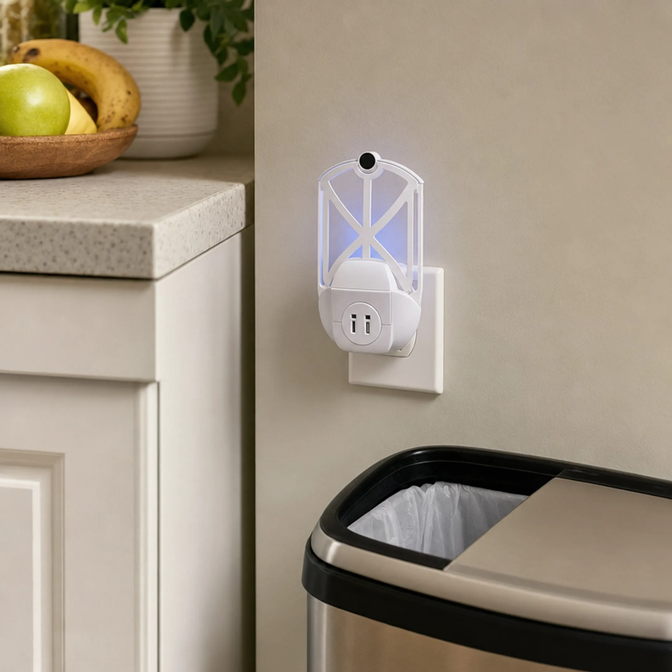 Plug-in UV insect trap with adhesive cartridge on kitchen counter