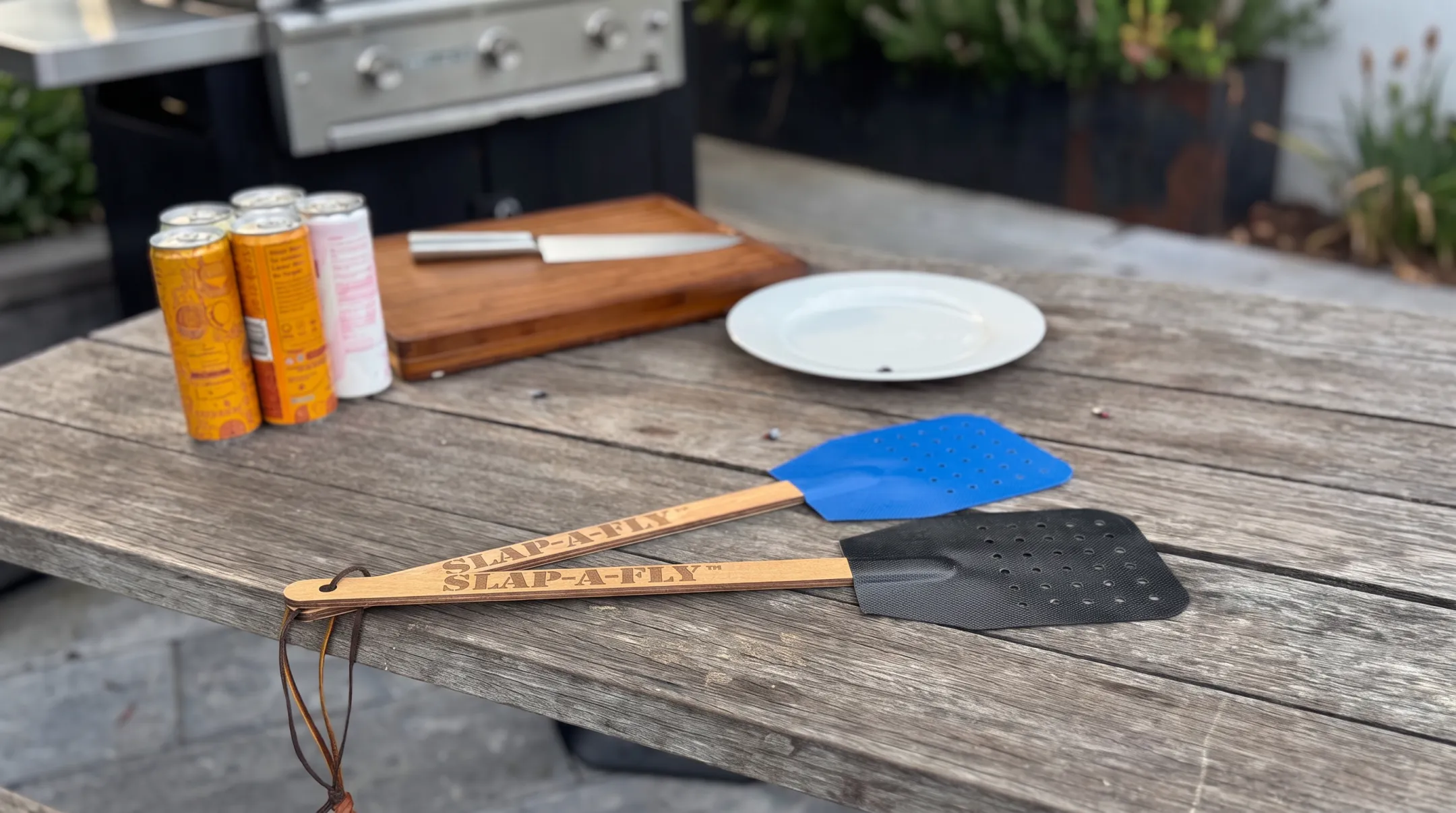 Slap-a-Fly flyswatter showing perforated mesh and wooden handle design
