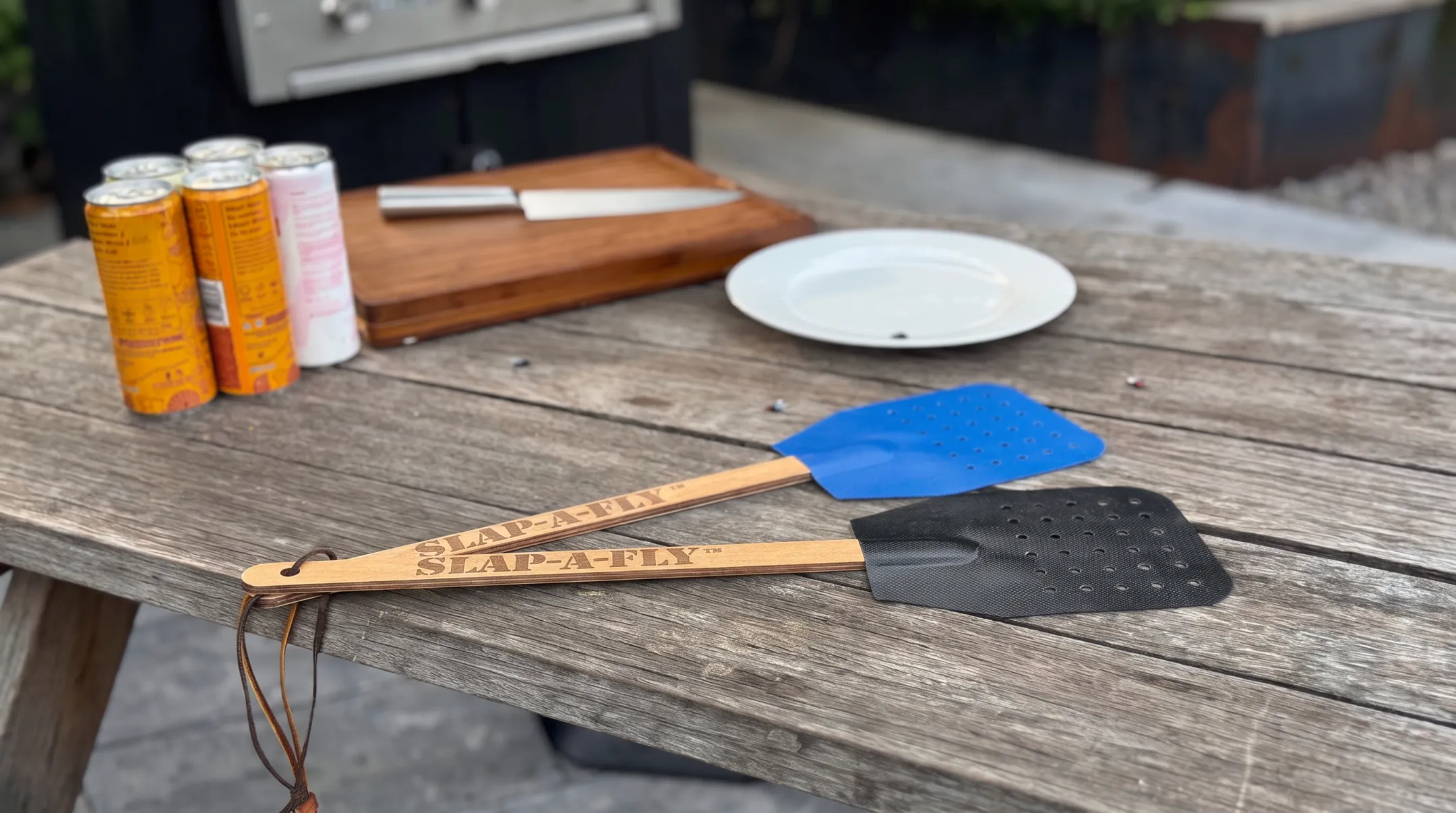 Slap-a-Fly swatter with perforated Herculite 80 fabric striking surface