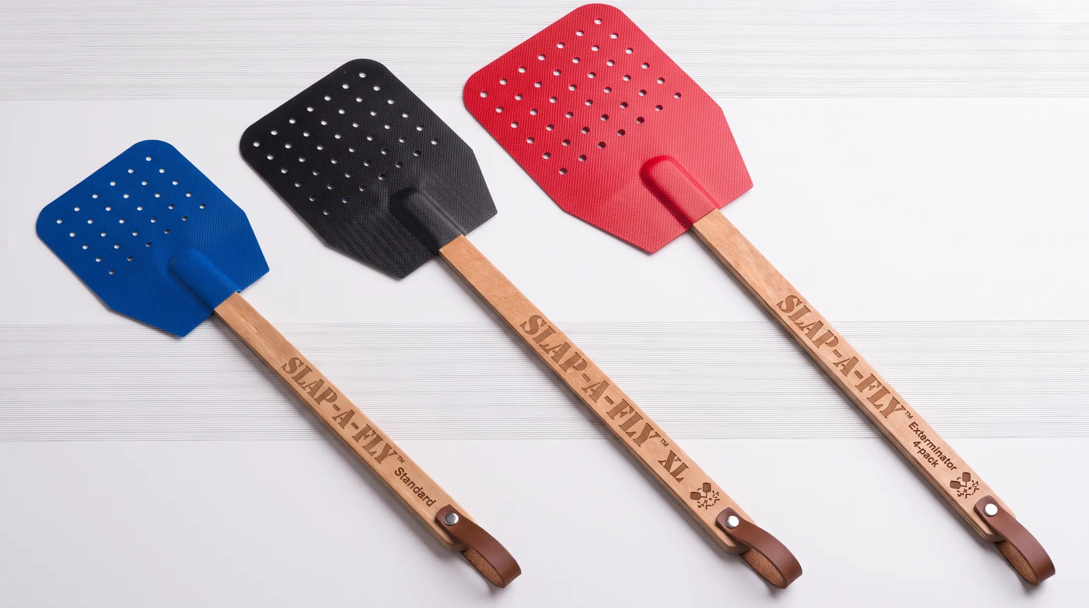 Slap-a-Fly swatter product lineup showing standard XL and 4-pack models