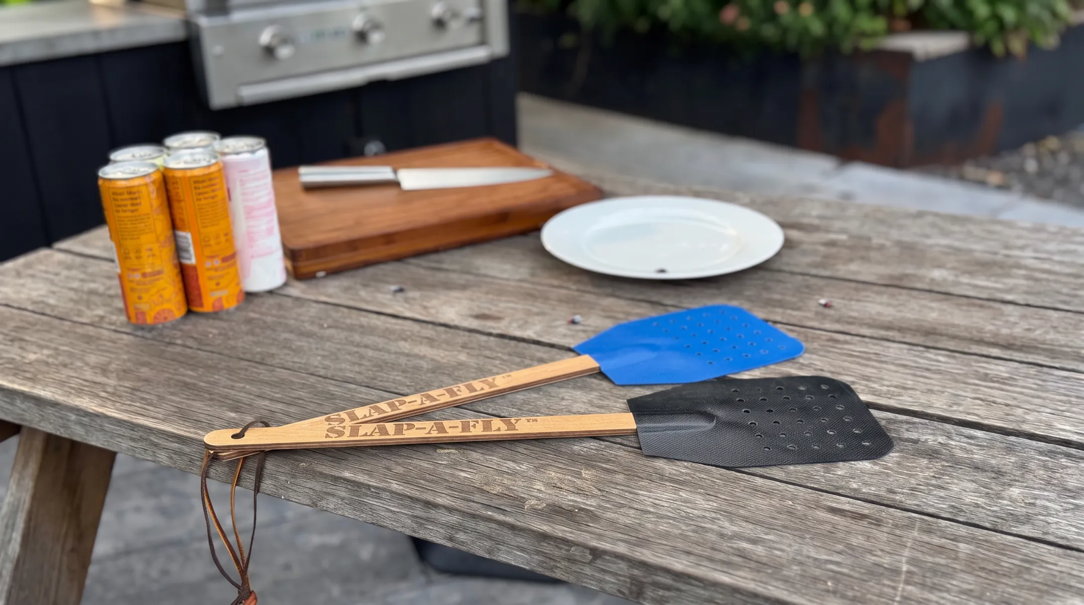 Slap-a-Fly flyswatter with perforated mesh and wooden handle
