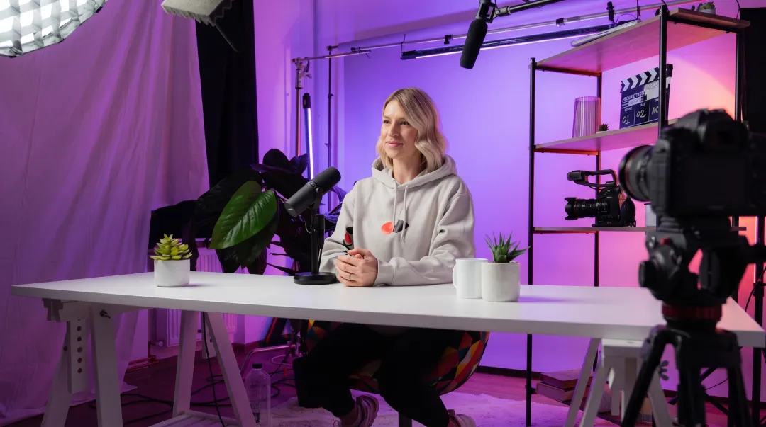 Content creator recording professional video podcast in studio setting