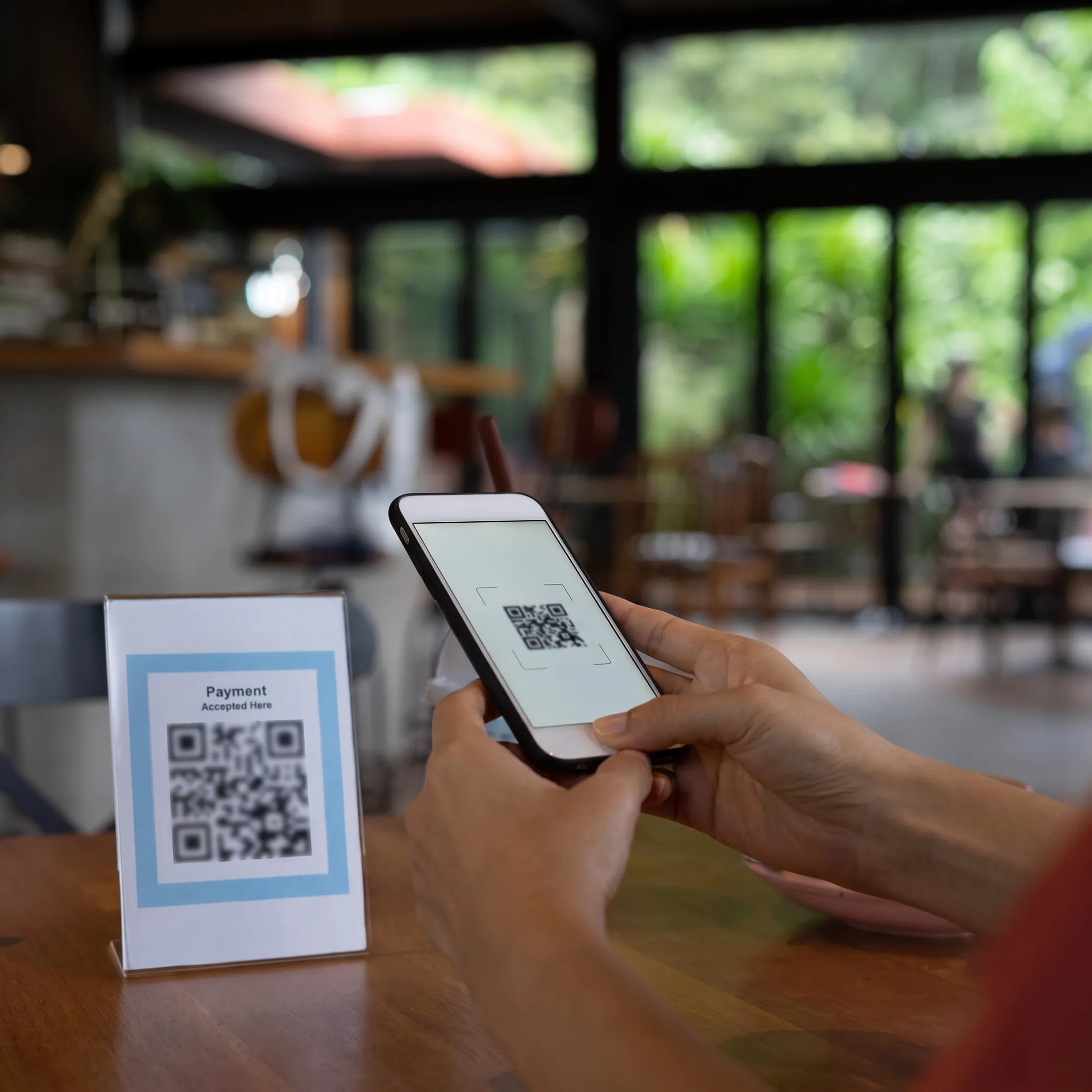 Restaurant guests using QR codes to order food and cocktails