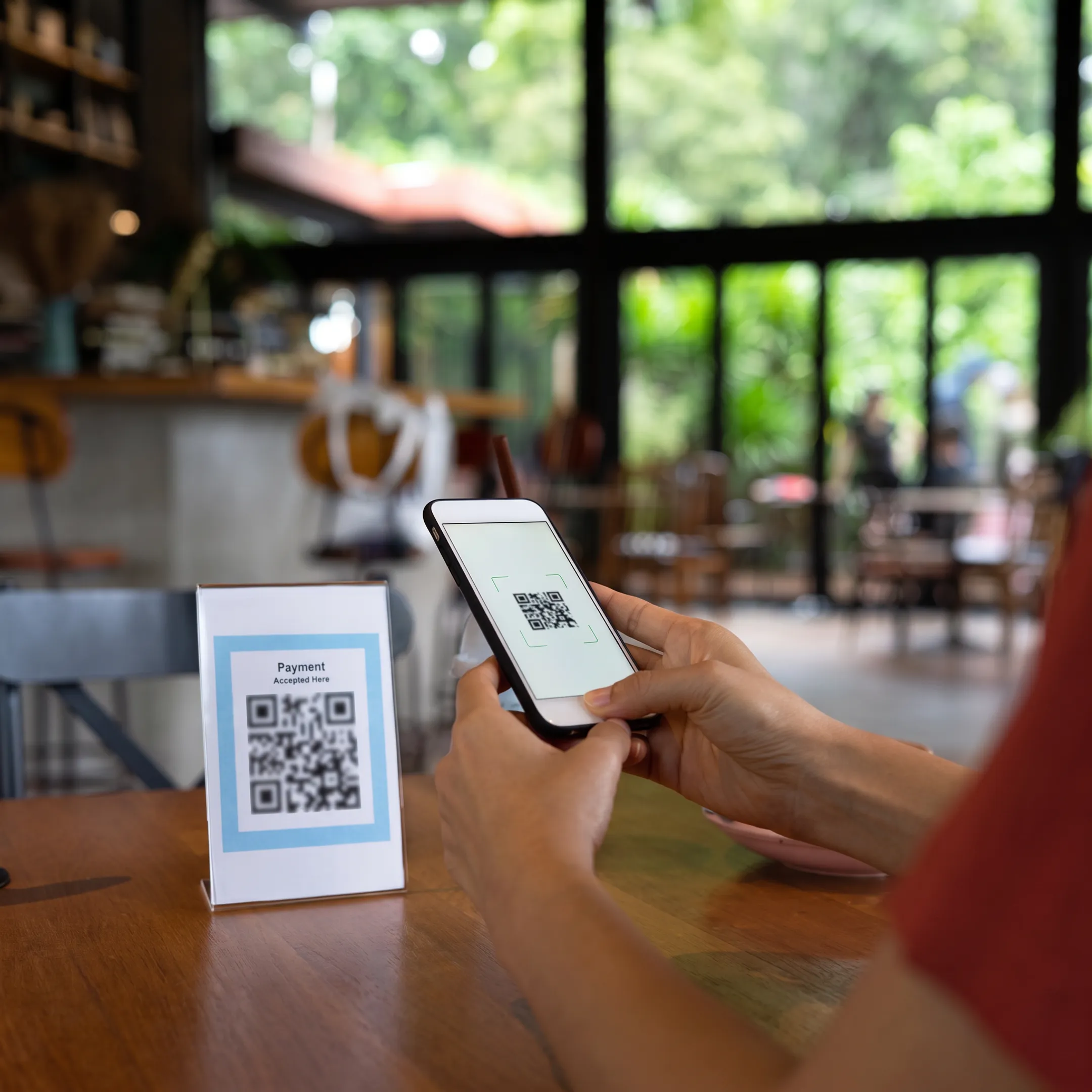 Guest using mobile QR ordering at a restaurant