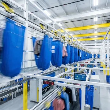 Modern automated laundry facility with advanced sorting and material handling systems