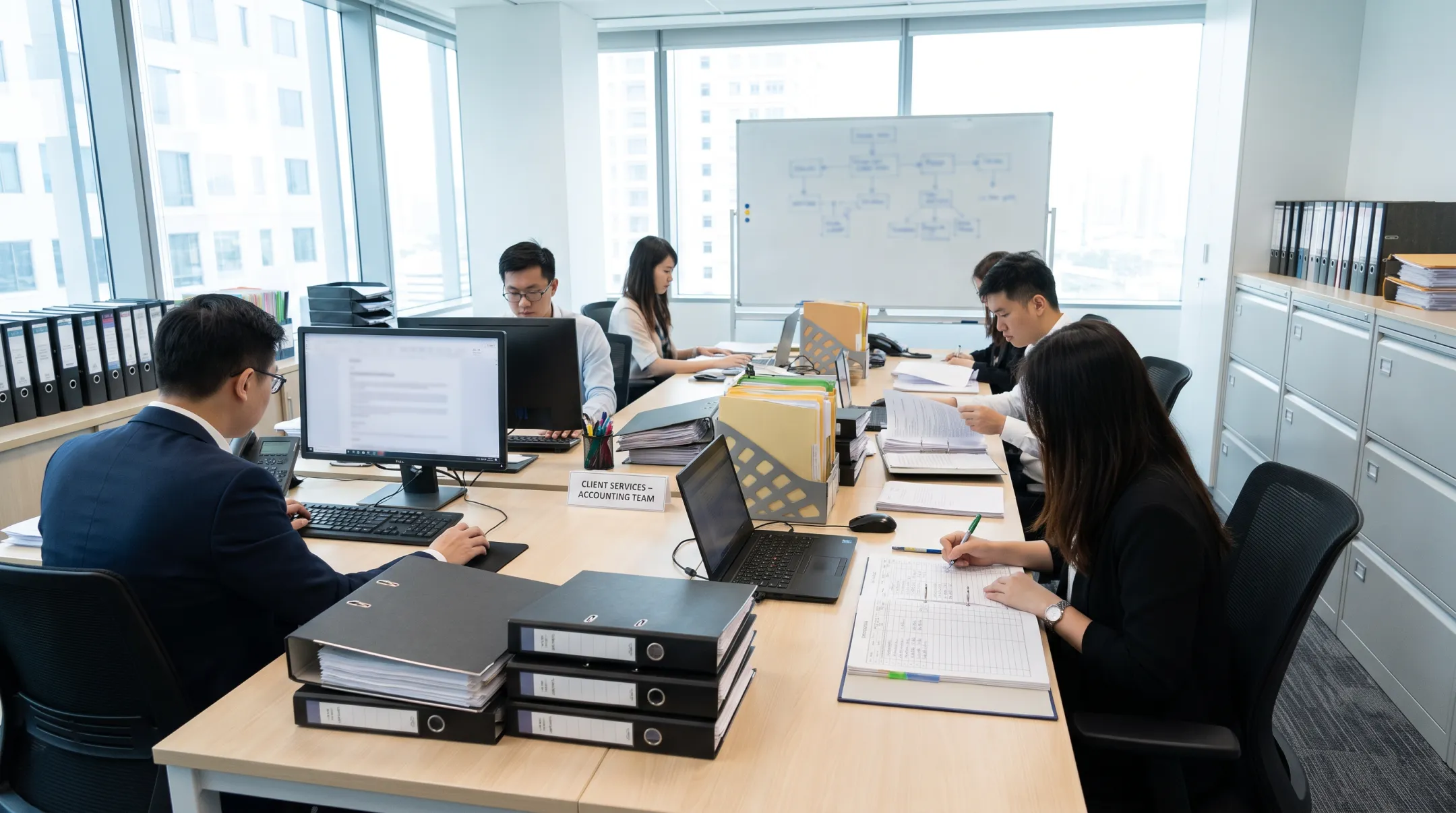 SolvedAF bookkeeping team reviewing client records and clearing invoice backlog