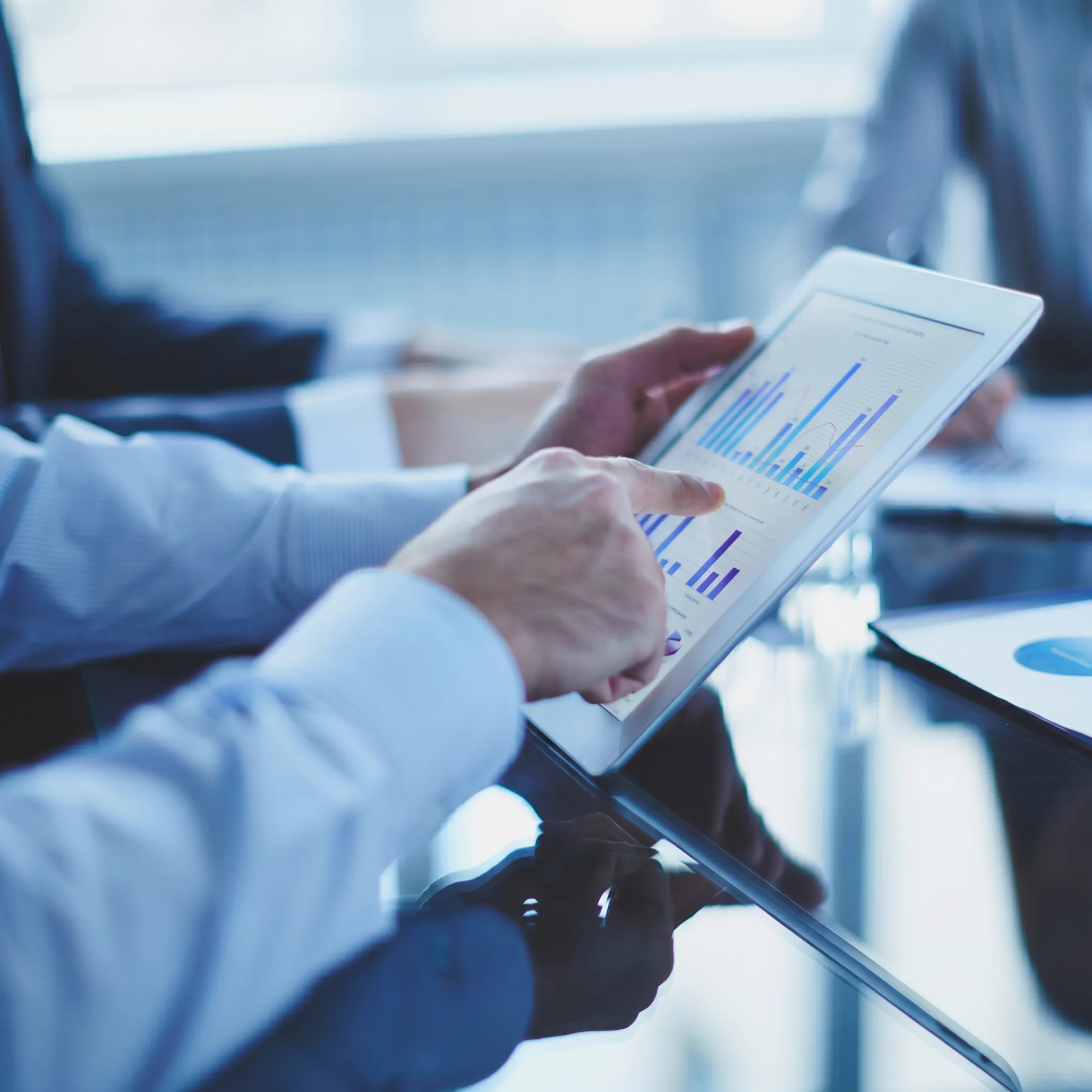 Fractional CFO reviewing financial reports with a growing business leadership team