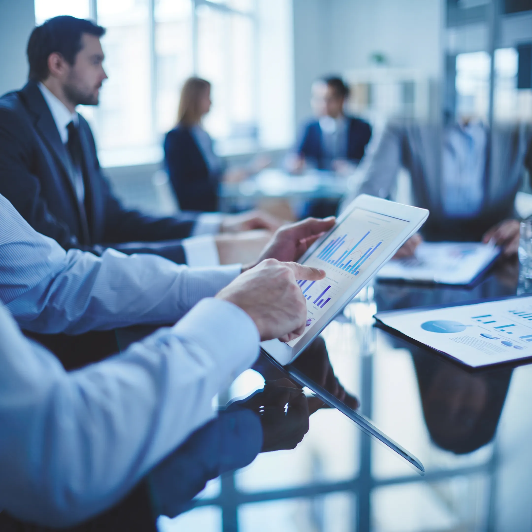 Executive technology leader discussing a strategic roadmap with business stakeholders
