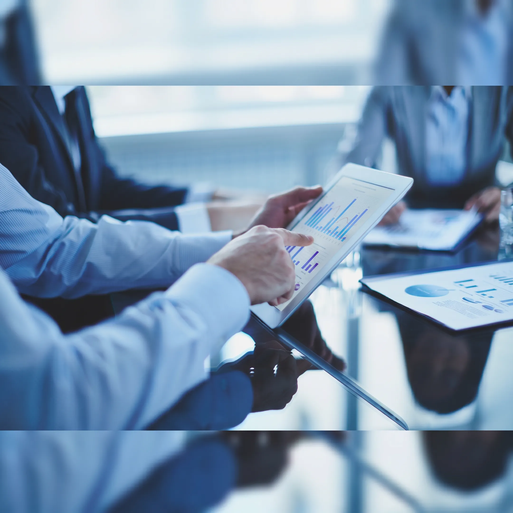 Fractional CFO reviewing restaurant financial reports with management team