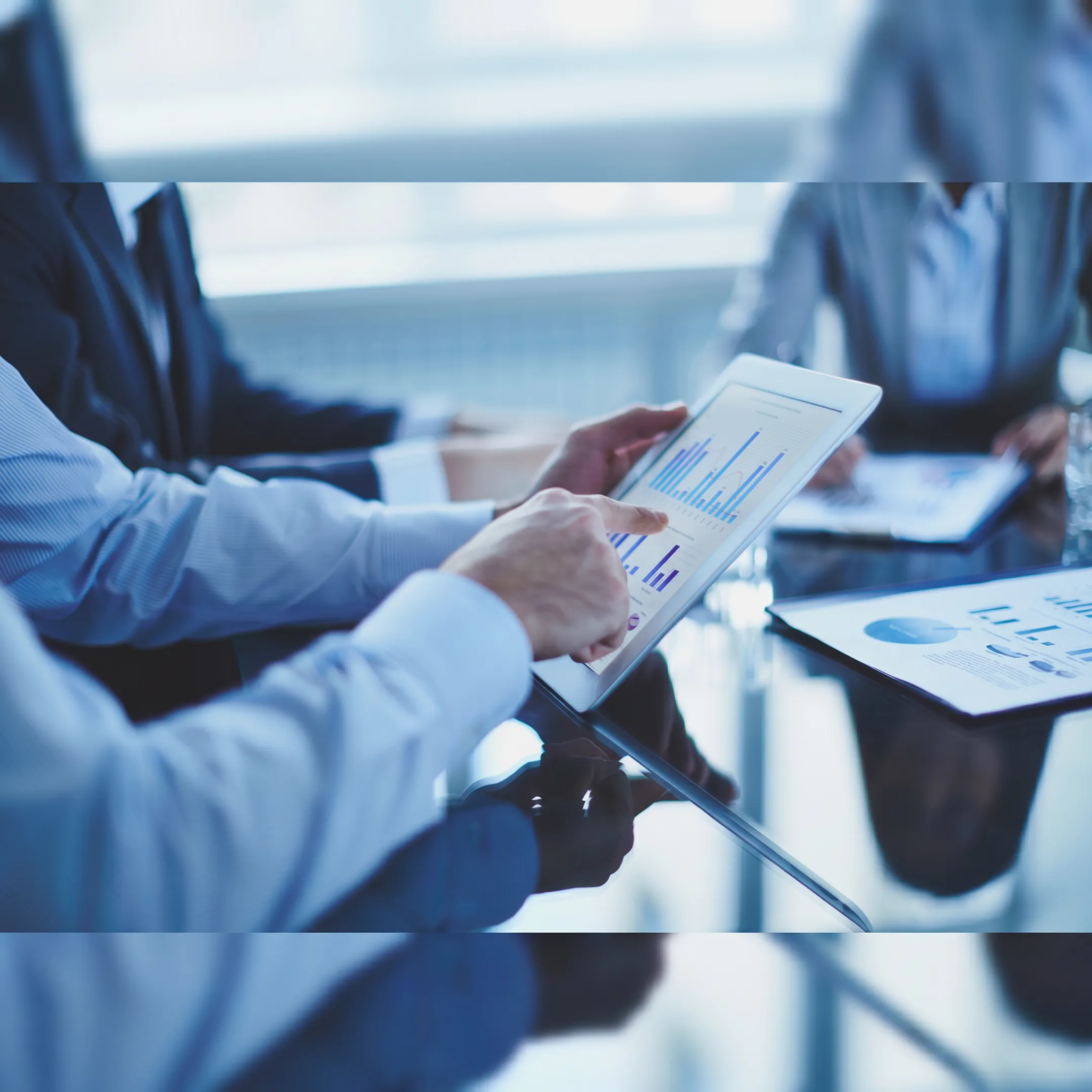 CFO analyzing restaurant performance dashboard and financial statements