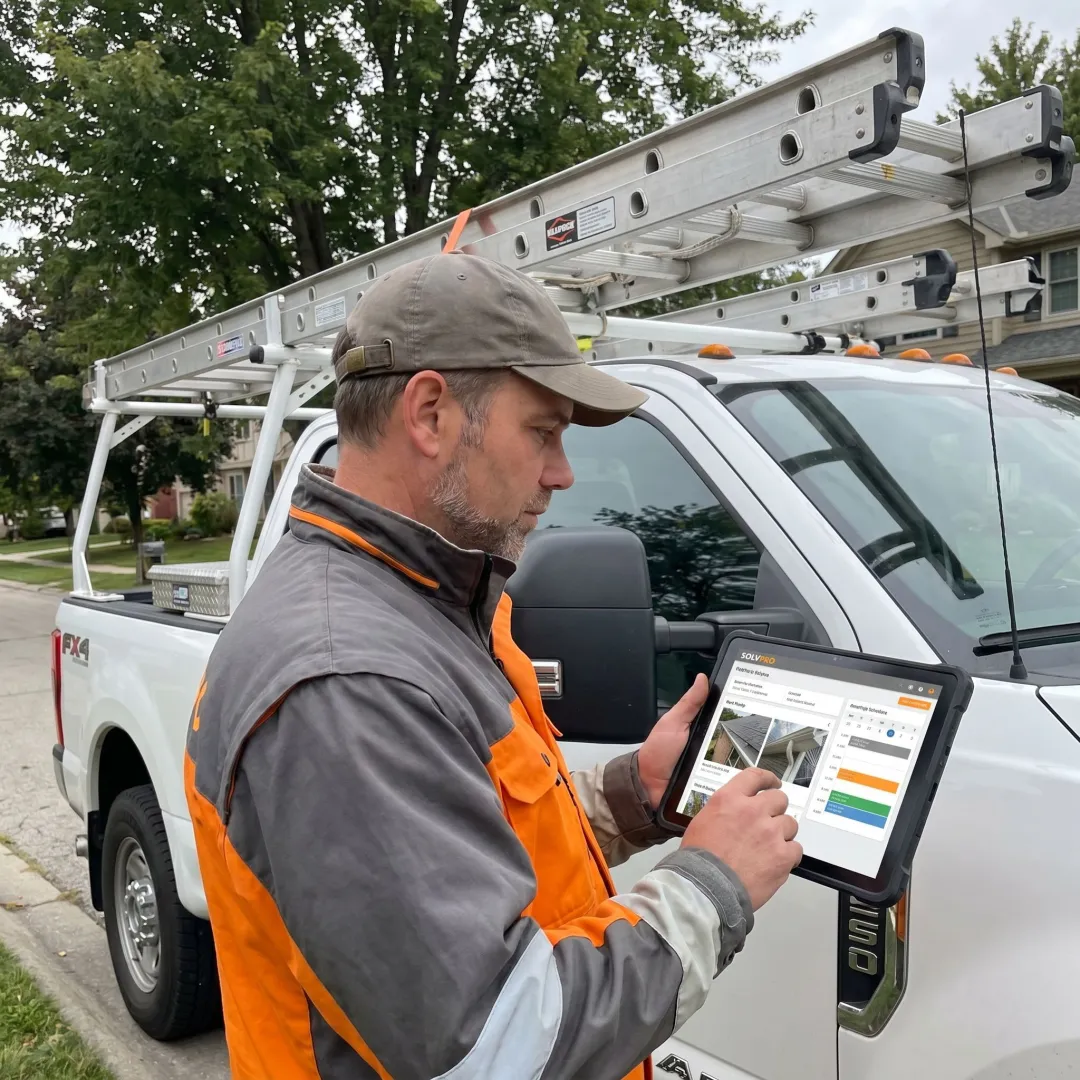 Gutter contractor managing job tracking software