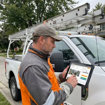 Gutter contractor managing job tracking software