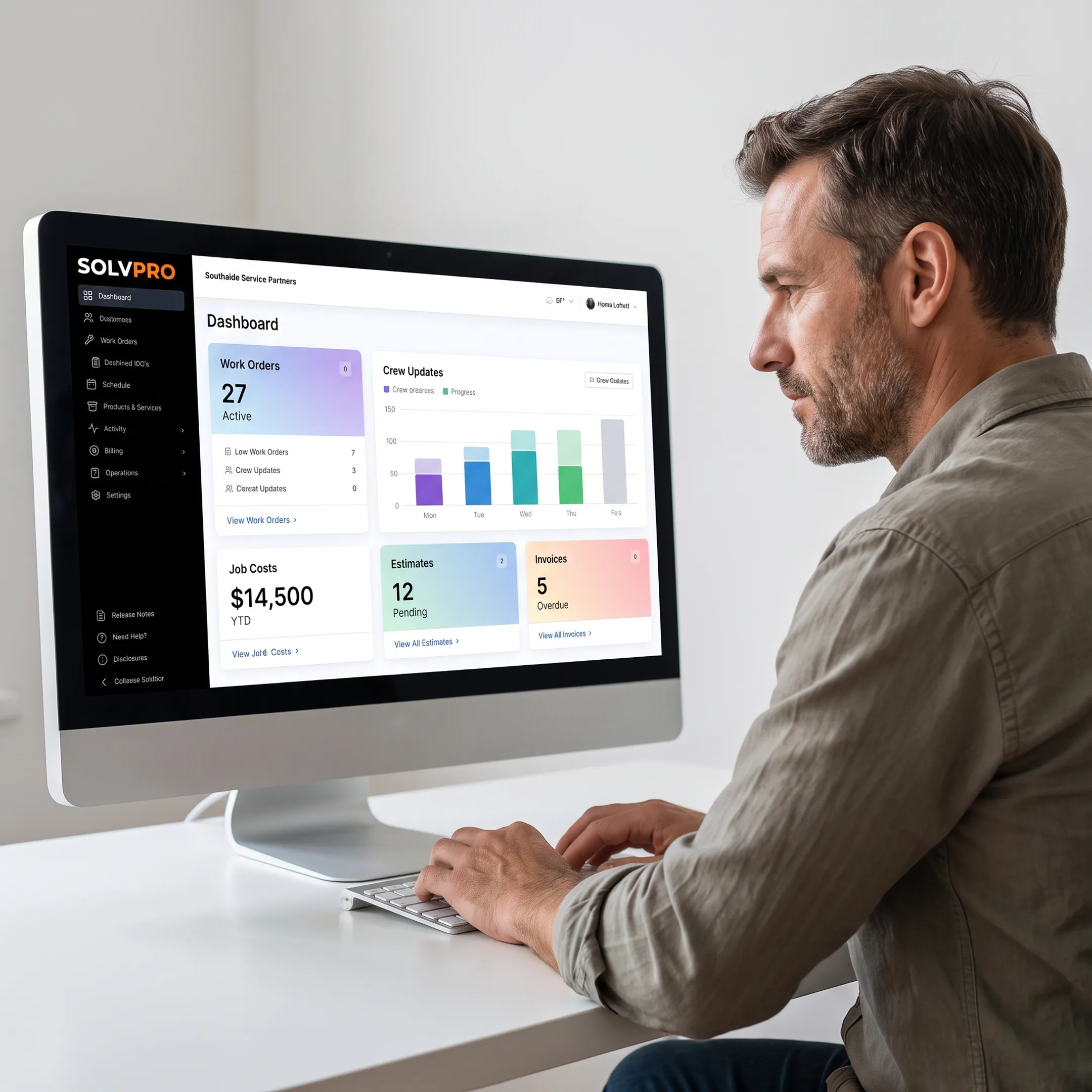 Service business manager reviewing job details and costs