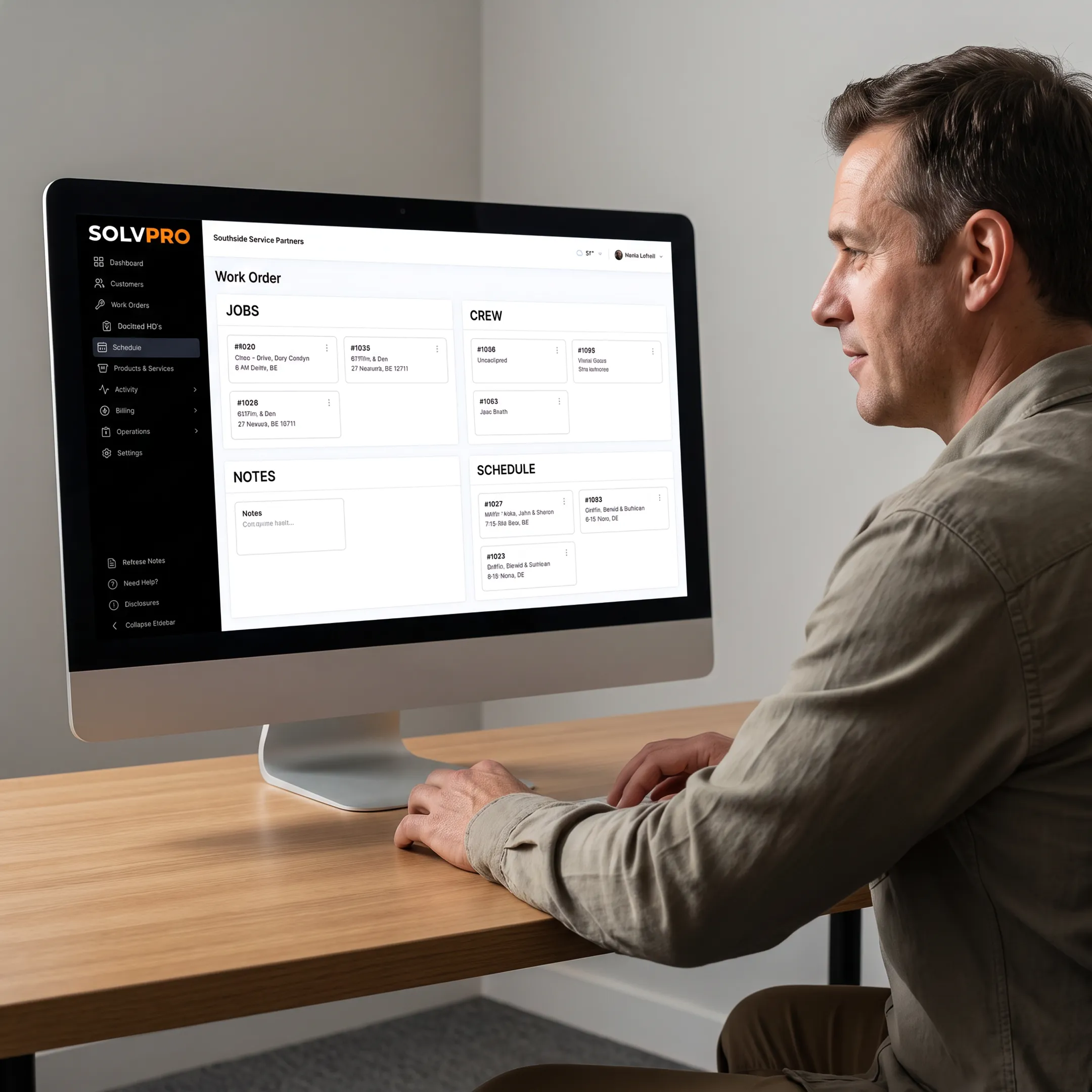 Manager coordinating customer jobs through scheduling software
