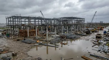 Severe weather storm damage to active construction site showing structural exposure