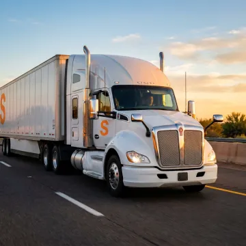 A large commercial truck on the road, representing motor truck cargo insurance.