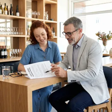 Insurance specialist reviewing liquor liability policy for a Georgia business owner