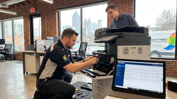 Southern Office Machines technician servicing multifunction printer document management system