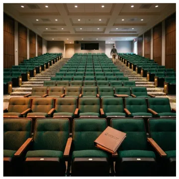Modern auditorium with rows of fixed theater seating