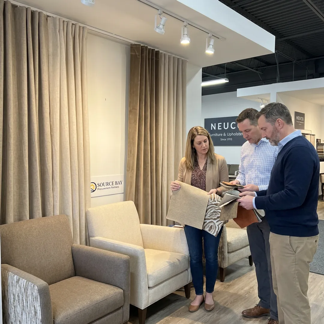 Commercial upholstery team reviewing fabric samples