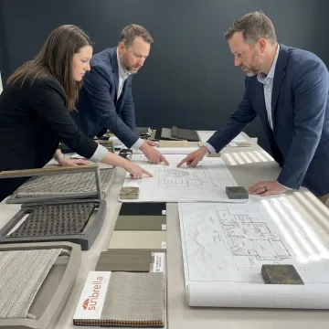 Healthcare design team reviewing outdoor furniture materials
