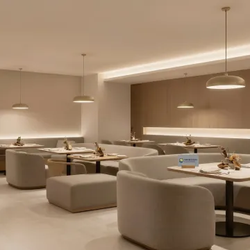 Custom tables and seating in a refined restaurant dining room