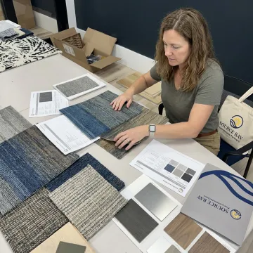 Commercial flooring samples reviewed with interior finish materials