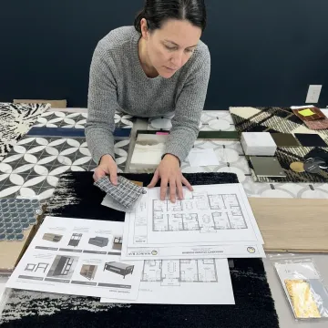 Designer reviewing student housing furniture samples