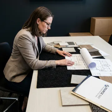Designer reviewing commercial carpet samples