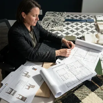 Designer reviewing restaurant upholstery and furniture samples