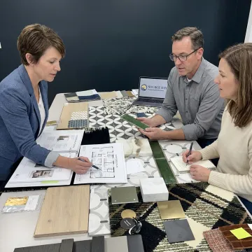 Hospitality team reviewing hotel furniture finishes