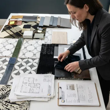 Designer reviewing hospitality fabric swatches
