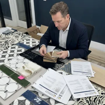 Designer reviewing hotel material selections