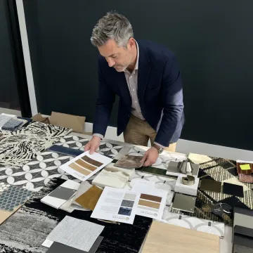 Designer reviewing hospitality furniture and finish samples