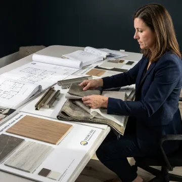 Designer reviewing commercial drapery samples