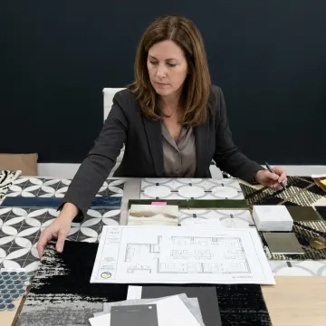Designer reviewing coffee shop material samples