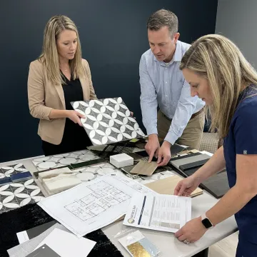Healthcare project team reviewing finish samples
