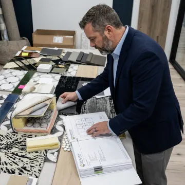 Procurement specialist reviewing commercial mattress samples