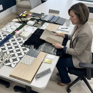 Designer reviewing student housing material samples
