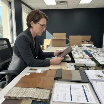 Designer reviewing commercial furniture finishes