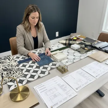 Designer reviewing hospitality furniture and finish samples