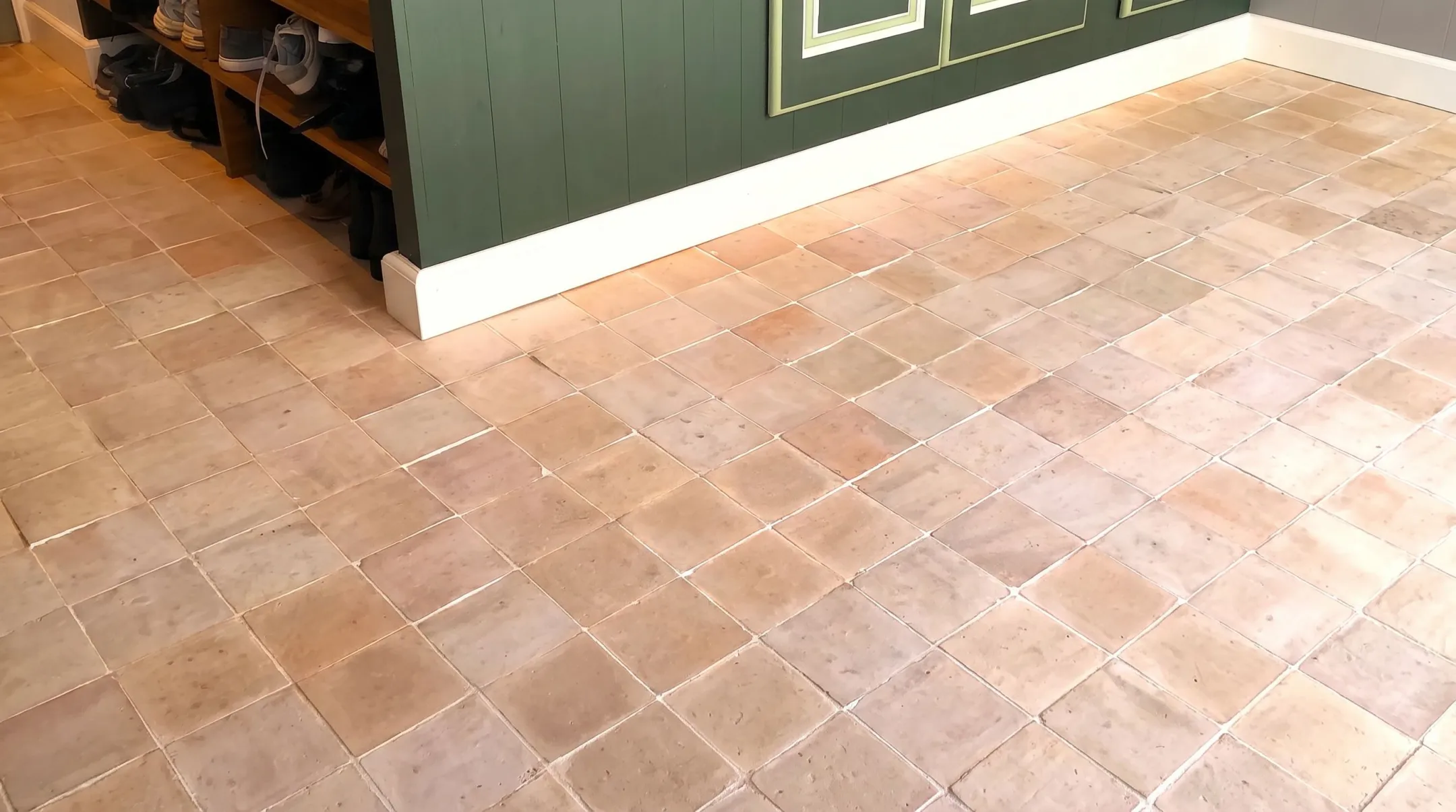 Unglazed natural clay tile flooring with earthy textured surface
