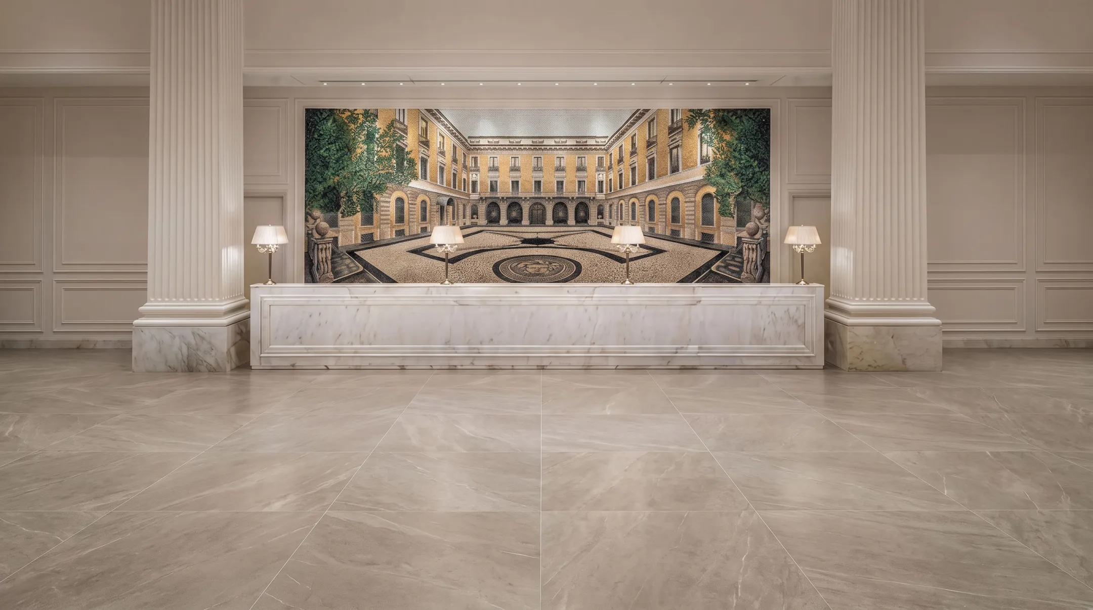 Hotel reception area with mosaic tile accent wall and large-format flooring