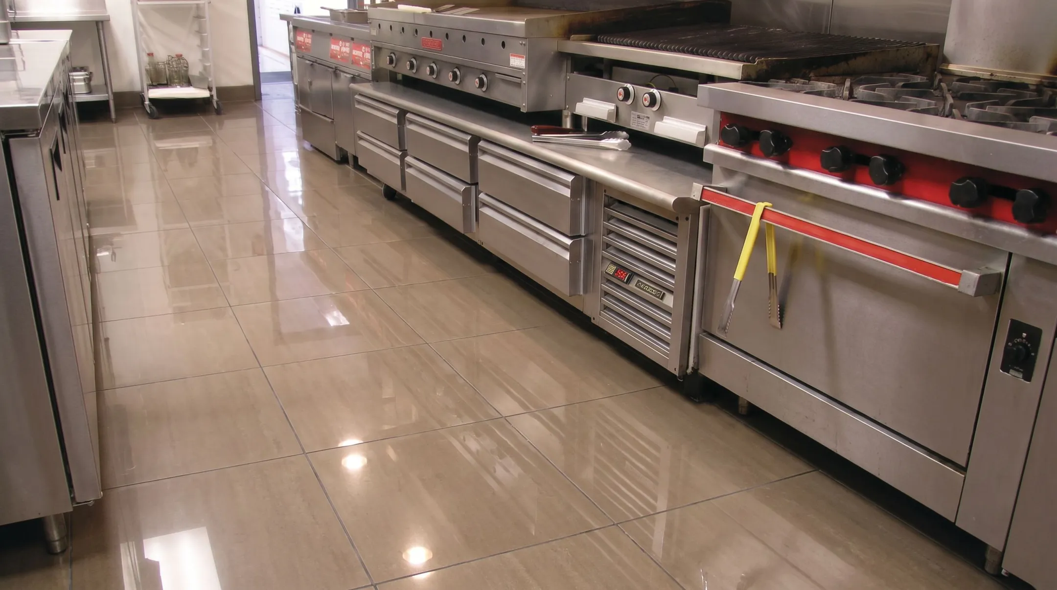 Porcelain tile flooring installed in busy commercial restaurant kitchen